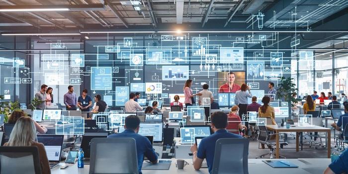 Moderne kontormiljø med ansatte og digitale enheter.